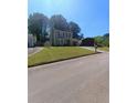 Charming two-story home with manicured lawn and attached garage at 2044 Mallard Crest, Lithonia, GA 30058