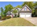 Charming two-story home with a well-manicured lawn and attached two-car garage at 4016 Upland Trce, Marietta, GA 30066