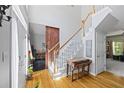 Bright foyer featuring a staircase, hardwood floors, and natural light at 4016 Upland Trce, Marietta, GA 30066