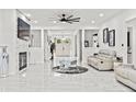 Bright, open living room with fireplace, modern decor, and abundant natural light at 1081 Humphries Nw Rd, Conyers, GA 30012