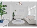 Cozy sitting room bathed in light, featuring plush seating and a calming atmosphere at 1081 Humphries Nw Rd, Conyers, GA 30012