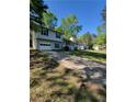 Two-story home with attached garage, cozy front porch and well-maintained front lawn at 4775 Ben Hill Rd, Douglasville, GA 30134
