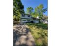 Two-story home with attached garage, nice front lawn and cozy front porch at 4775 Ben Hill Rd, Douglasville, GA 30134