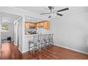 Cozy kitchen with breakfast bar, stainless appliances, pendant lights, and hardwood floors at 69 Country Place Ct, Alpharetta, GA 30005
