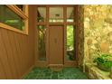 Charming front door framed by windows and stonework, providing a welcoming entrance to the home at 2208 Guinevere Ne Way, Atlanta, GA 30345