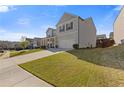 Beautiful home with a well-maintained lawn and a two-car attached garage at 81 Creekside Bluff Way, Auburn, GA 30011