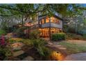 Beautiful backyard with a large deck, outdoor seating area, and mature trees for privacy at 3749 Watkins Ne Pl, Brookhaven, GA 30319
