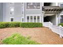 Exterior view of building entrance with manicured greenery and pine straw at 211 Summit North Drive Ne, Atlanta, GA 30324