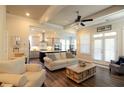 Open-concept living room featuring hardwood floors, modern furniture, and view to kitchen with island and stainless appliances at 351 Senna St, Marietta, GA 30064