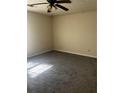 Neutral bedroom with a ceiling fan and plush gray carpeting at 4071 River Rd, Ellenwood, GA 30294