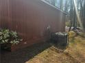 Exterior shot of the home featuring siding and an air conditioning unit at 4071 River Rd, Ellenwood, GA 30294