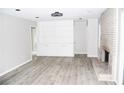 Spacious living room with fireplace and wood-look floors at 1584 Hebron Ln, Riverdale, GA 30296