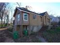Exterior shot of home undergoing renovations with newly installed windows at 2055 Marco Dr, Decatur, GA 30032