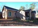 Rear view of an older home undergoing extensive construction and renovations at 2055 Marco Dr, Decatur, GA 30032
