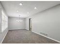 Bright and airy living room with neutral gray walls and plush gray carpet at 4442 Mark Anthony Ct, Decatur, GA 30035