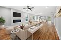 Open-concept living room with hardwood floors, a modern fireplace, and plenty of natural light at 2195 Springdale Sw Rd, Atlanta, GA 30315