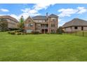 Large, level backyard with mature trees and landscaping, perfect for outdoor activities and entertaining at 5204 Heron Bay Blvd, Locust Grove, GA 30248