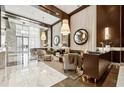 Opulent building lobby with marble floors, modern seating, and sleek reception area at 1820 Peachtree Nw St # 804, Atlanta, GA 30309