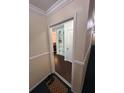 Inviting hallway with elegant trim and doorway view of built in bookshelf at 6851 Roswell Rd # O10, Atlanta, GA 30328