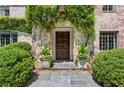 Inviting front entryway with stone pathway and planters at 2648 Rivers Nw Rd, Atlanta, GA 30305