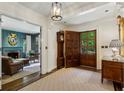 Grand foyer featuring wood floors, a decorative rug, and a view of the den at 2648 Rivers Nw Rd, Atlanta, GA 30305