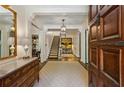 Elegant foyer features a staircase, chandelier, and beautiful hardwood floors at 2648 Rivers Nw Rd, Atlanta, GA 30305