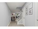 Bright entryway with neutral walls and flooring leading into a living space with a cozy fireplace at 4643 Grand Central Pkwy, Decatur, GA 30035