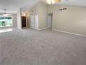 Large living room with neutral paint, carpeted floor, and lots of natural light at 3510 Beaver Cove Rd, Cumming, GA 30041