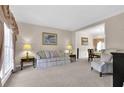Cozy living room with neutral tones and ample natural light at 200 Boca Ciega Ct, Alpharetta, GA 30022