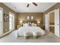 Bedroom with a king-sized bed, neutral decor, and an ensuite bathroom at 25 High Gate Trail, Atlanta, GA 30030
