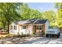 Charming single story home featuring a gravel driveway, manicured landscaping, and a classic, all-American aesthetic at 2086 Harold Se Ave, Smyrna, GA 30080
