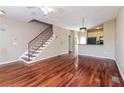 Inviting living room with gleaming wood floors, decorative lighting, and a staircase leading to the upper level at 432 Ira Sw St # 201, Atlanta, GA 30312