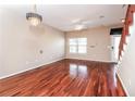 Bright living room featuring beautiful wood floors, modern lighting, and a view of the private entrance at 432 Ira Sw St # 201, Atlanta, GA 30312