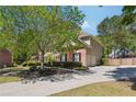 Spacious three car garage and long driveway add convenience to this brick two story home at 715 Aronson Lake Ct, Roswell, GA 30075