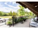 Tranquil front porch with wrought iron railings and a view of nature at 1952 Maritime Way, Atlanta, GA 30318
