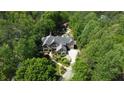An aerial shot showcasing this secluded property surrounded by lush trees, pool, and serene setting at 5178 S Trimble Rd, Atlanta, GA 30342
