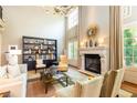 Spacious living room with high ceilings, fireplace, and stylish decor, perfect for entertaining at 5178 S Trimble Rd, Atlanta, GA 30342
