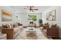 Bright living room featuring stylish furnishings, a ceiling fan, and ample natural light at 5180 Stone Trce, Stone Mountain, GA 30083