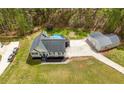 Expansive aerial view of home with a large yard, detached garage and pool at 127 Pebblebrook Way, Temple, GA 30179