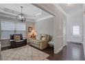 Inviting living room boasts recessed lighting, natural light, and elegant trim work at 486 Crestmont Ln, Canton, GA 30114