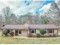 Charming single-story home with a well-maintained lawn and neutral-colored siding and brown trim at 133 Dailey Mill Rd, Mcdonough, GA 30253