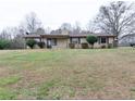 Charming single-story home with a well-maintained lawn and neutral-colored siding and brown trim at 133 Dailey Mill Rd, Mcdonough, GA 30253
