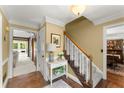Inviting foyer with hardwood floors, staircase, and views into the living and dining rooms at 4813 Fernie Ne Ct, Marietta, GA 30068