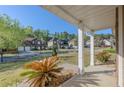 Inviting front porch view showcasing well-maintained landscaping and neighboring homes on a sunny day at 5840 Harrier Ln, Atlanta, GA 30349