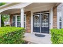 Charming home featuring a welcoming entryway with double doors and stone accents at 203 Setters Rdg, Canton, GA 30115