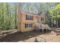 The exterior showcases a quaint porch, well-maintained siding, and classic architecture with mature landscaping at 464 Meadowbrook Dr, Mcdonough, GA 30253