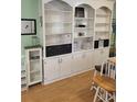Built-in shelving featuring ample storage space and display areas at 4561 N Woodlake Se Ln, Conyers, GA 30013