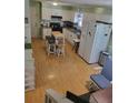 Functional kitchen featuring an island, white cabinets, and modern appliances at 4561 N Woodlake Se Ln, Conyers, GA 30013