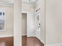 Bright entryway featuring hardwood floors, closet, and a glass-paneled front door at 4343 Ainsley Mill Ln, Duluth, GA 30097