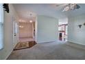 Spacious living room features hardwood floors, natural light, and a view of the adjacent dining area and kitchen at 5221 Huntcrest Sw Pl, Mableton, GA 30126